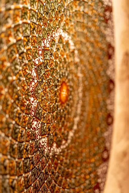 An intricately decorated domed ceiling in a boutique hotel.